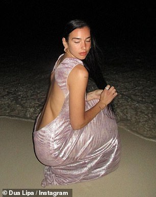 Posing: She crawled around a beach in a mystery location